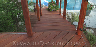 Our Kumaru Decking makes a safe walking surface around the pool.
